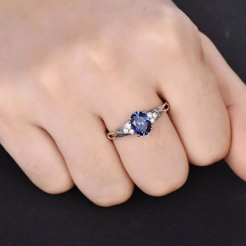 women diamond band engagement rings -Cluster Blue Oval Cut Sapphire And Diamond Engagement Ring